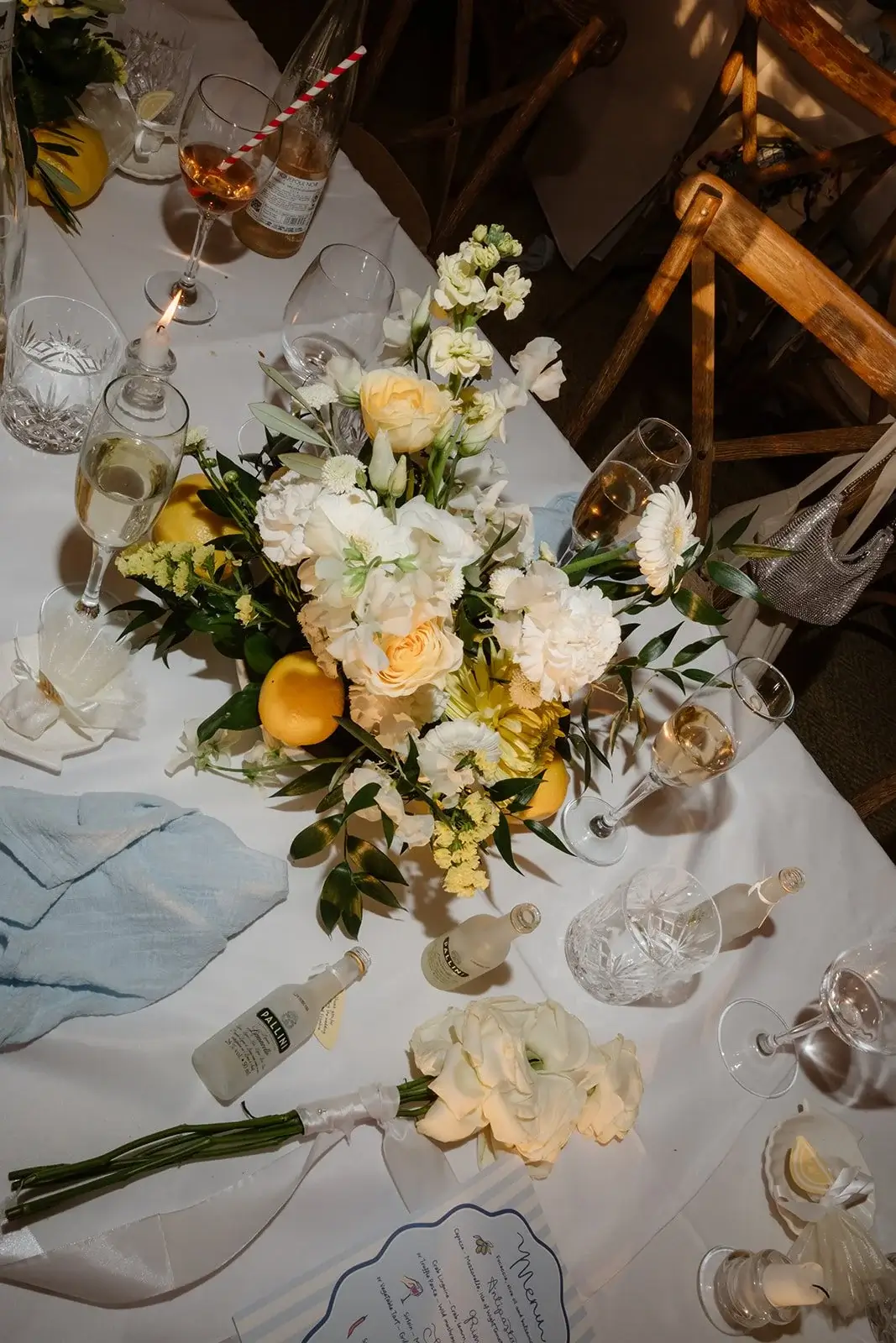 Ceremony aisle with abundant blooms and rolling countryside backdrop