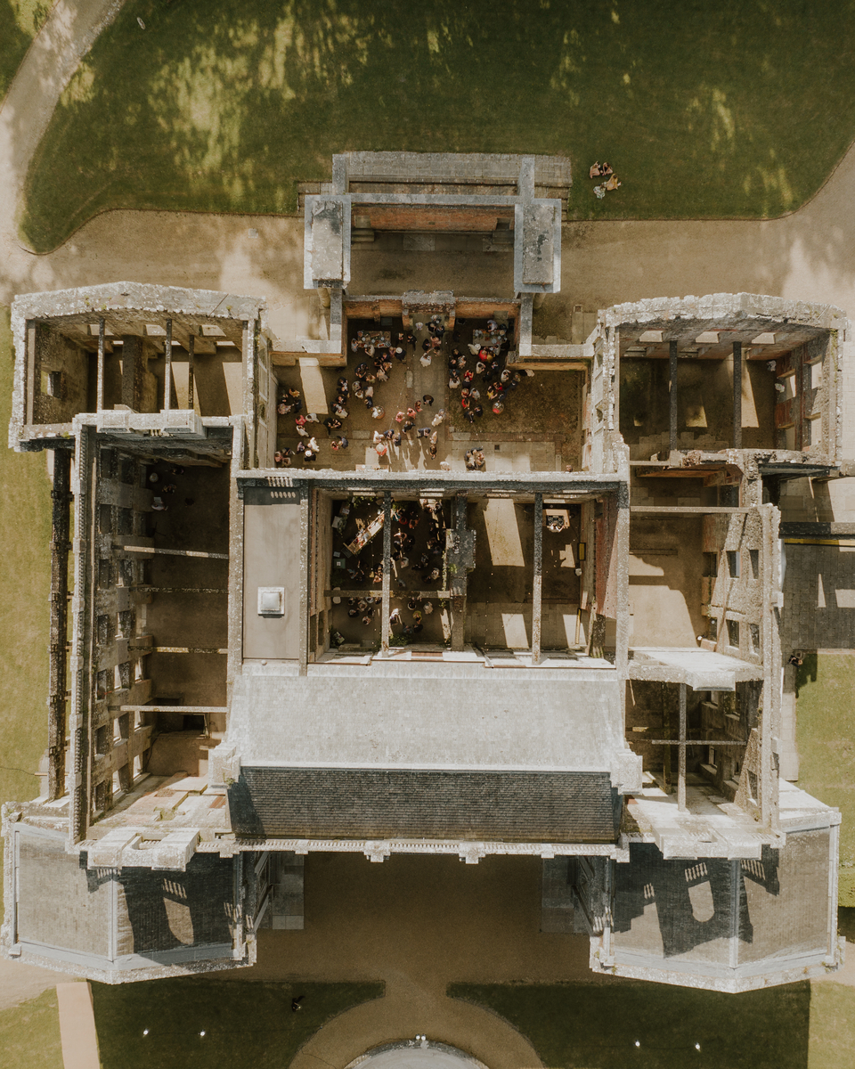 Overhead drone shot of the ceremony taking place inside the roofless Appuldurcombe ruins