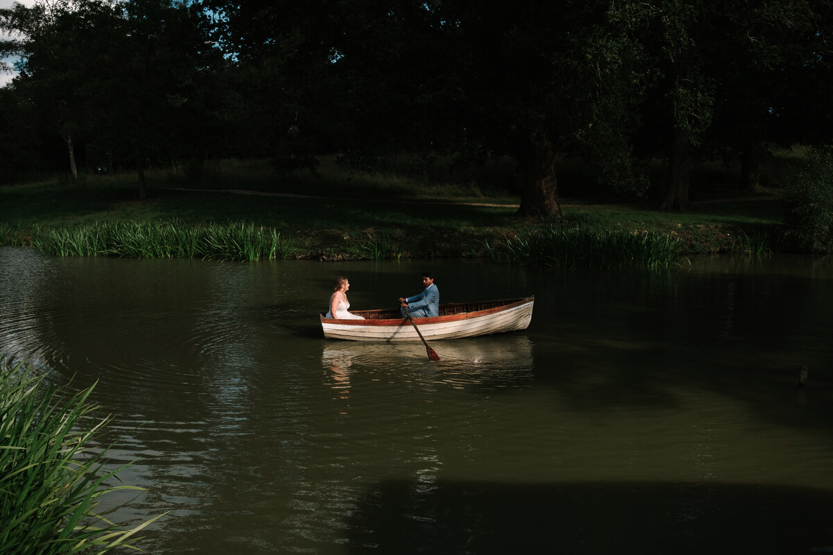 Lily & Ash rowing on the lake at Barton Manor