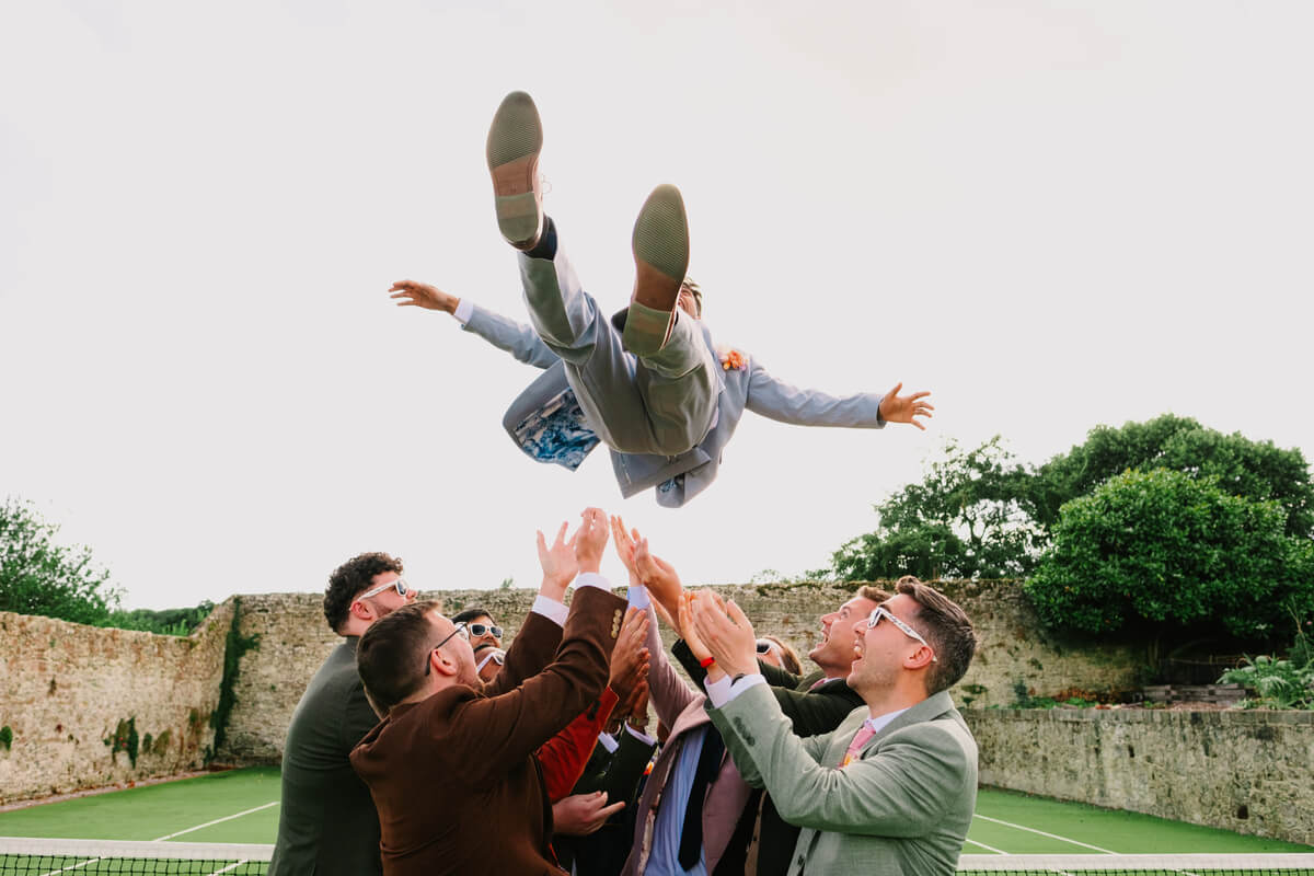 Groom launched into the air by his ushers