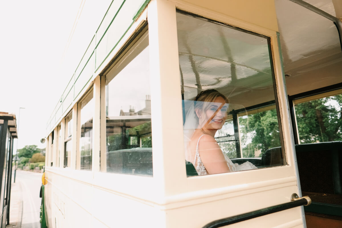 Vintage cream wedding bus at Barton Manor