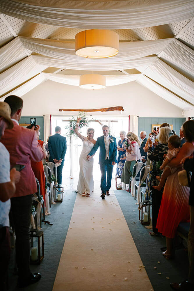Candlelit yurt interior with fairy lights and wildflower arrangements