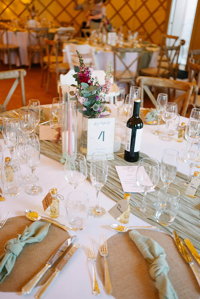 Wedding guests in the woodland setting at Priory Bay